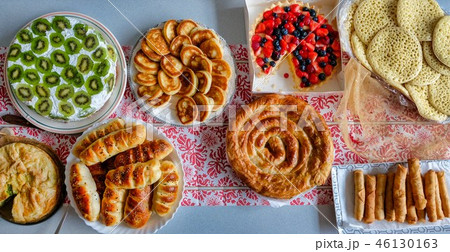Delicious food and pies on a table Delicious food and pies on a table 46130163