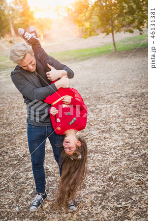 Caucasian Young Man and Mixed Race Girl Outdoors Caucasian Young Man and Mixed Race Girl Outdoors 46131381