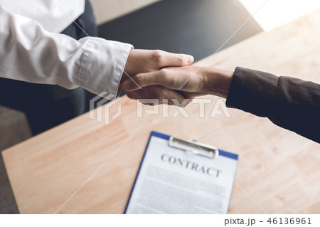 Confident partnerships people shaking hands 46136961