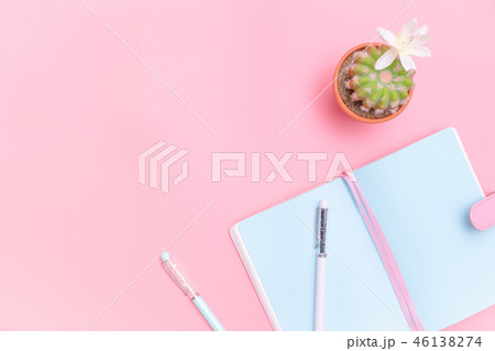 workspace desk office supplies with cactus on pink 46138274