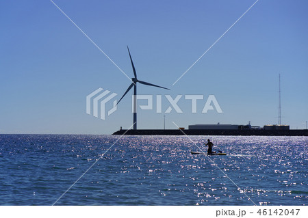 Atlantic ocean shore at the sunset. Wind turbines 46142047
