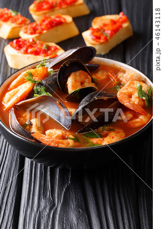 Traditional tomato seafood soup 46143118