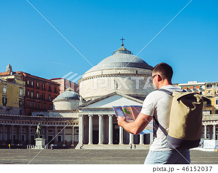 Handsome man holding a map  46152037