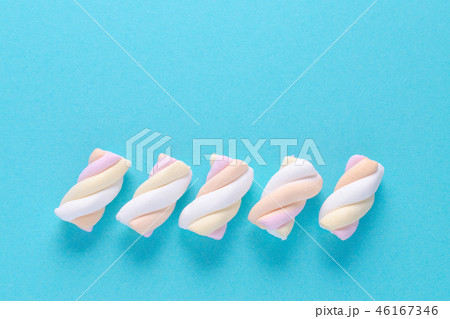 five marshmallow in pastel colors on blue background five marshmallow in pastel colors on blue background 46167346