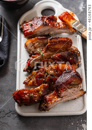 Delicious barbecued ribs seasoned with a spicy basting sauce. lose-up, copy space. 46168763
