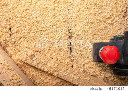 the electric sander on a wood backgroundshavings the electric sander on a wood backgroundshavings 46171015