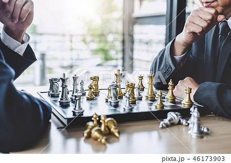 Two businessman playing chess game to plan strategy for success, Two businessman playing chess game to plan strategy for success, 46173903