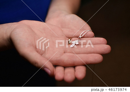 Orthodox cross in the hands of a woman mother Orthodox cross in the hands of a woman mother 46173974