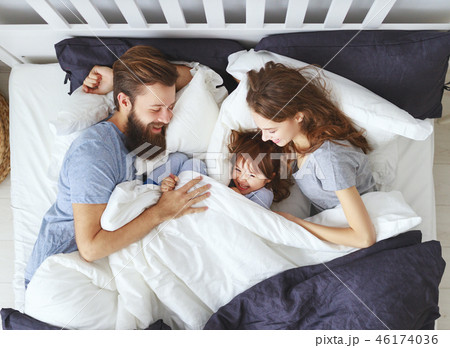 happy family mother, father and child  in bed. 46174036