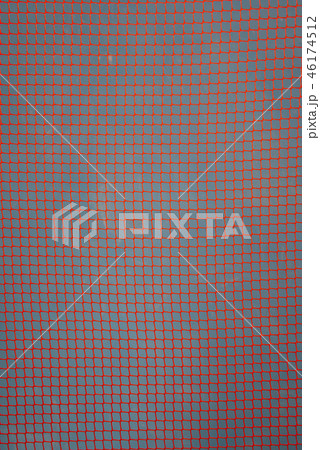 orange garden plastic fence mesh isolated on blue orange garden plastic fence mesh isolated on blue 46174512