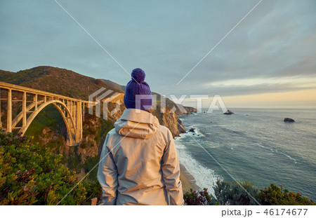 Woman tourist near Bixby Creek Bridge in California Woman tourist near Bixby Creek Bridge in California 46174677