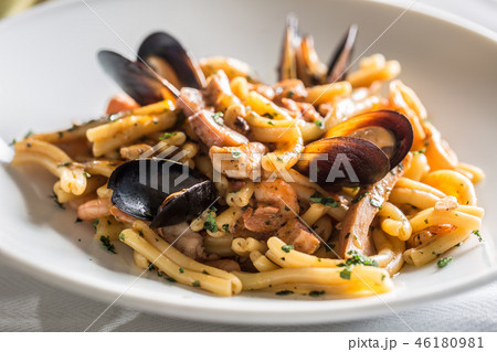 Italian pasta with mussels and prawn in plate. Italian pasta with mussels and prawn in plate. 46180981