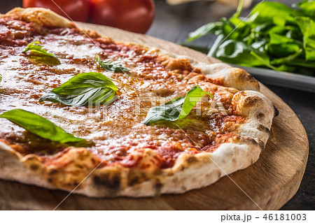 Italian traditional pizza margarita on round board 46181003