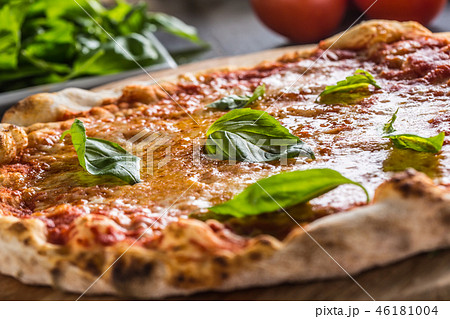 Italian traditional pizza margarita on round board Italian traditional pizza margarita on round board 46181004
