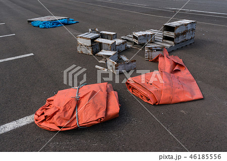Orange tarp and broken boxes 46185556
