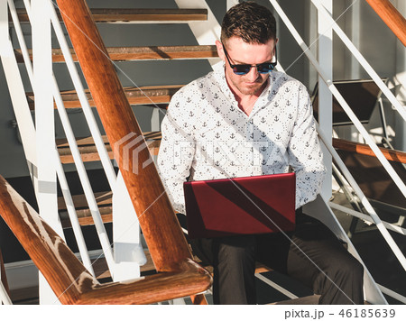 Stylish, attractive man with laptop 46185639