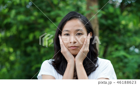 South East Asian girl looking green background 46188623