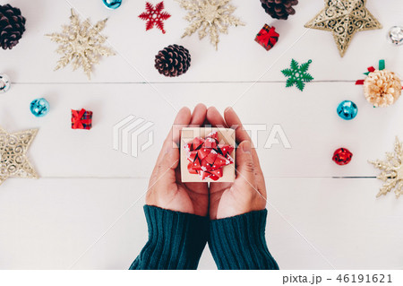 Top view of hand holding christmas gift Top view of hand holding christmas gift 46191621