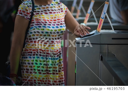 Tourists at pedestrian access control flap barrier 46195703