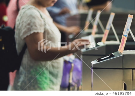 Tourists at pedestrian access control flap barrier 46195704