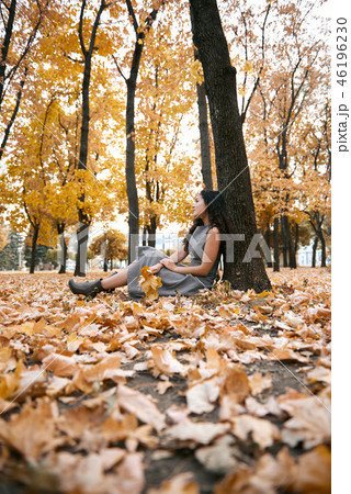 Pretty woman is in autumn park Pretty woman is in autumn park 46196230