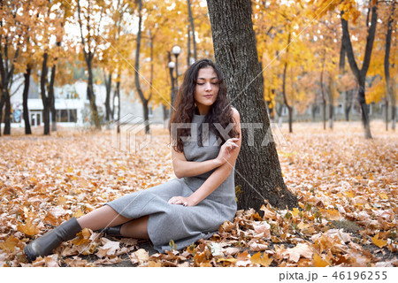 Pretty woman is in autumn park Pretty woman is in autumn park 46196255