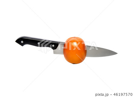 Persimmon wirh knife inside, cut in half. Isolated on a white background, with clipping path 46197570