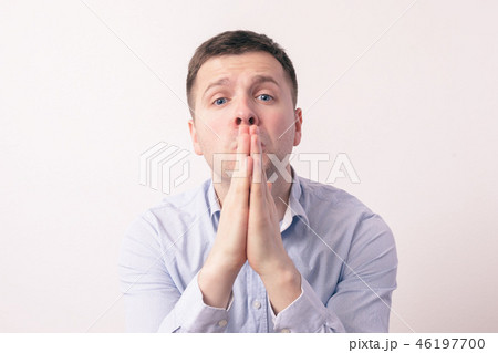 Young man in shirt begging for something Young man in shirt begging for something 46197700
