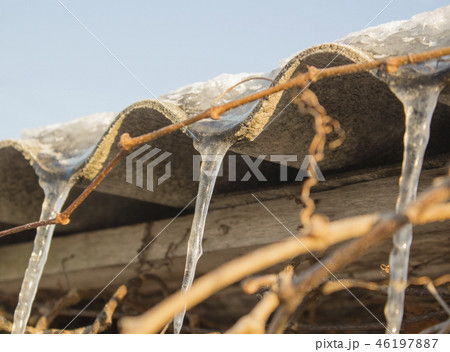 icicles which are hanging down from a roof icicles which are hanging down from a roof 46197887