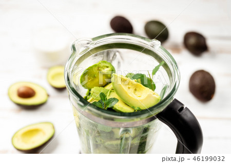 Top view of blender with avocado peaces Top view of blender with avocado peaces 46199032