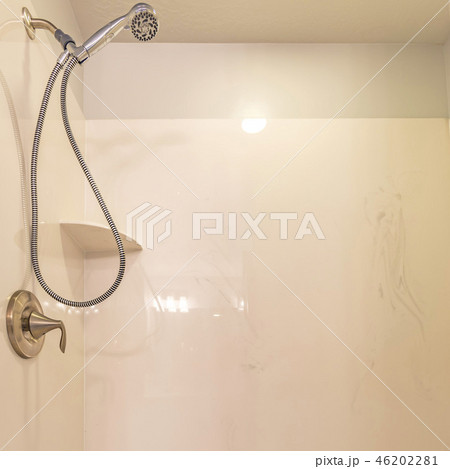 Handshower inside a white walled bathroom Handshower inside a white walled bathroom 46202281