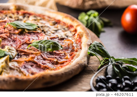 Pizza Quatro Stagioni traditional italian meal. Pizza Quatro Stagioni traditional italian meal. 46207611