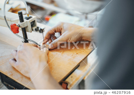 The carpenter works with a tree The carpenter works with a tree 46207916