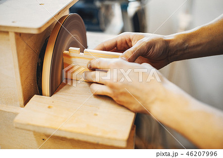 The carpenter works with a tree The carpenter works with a tree 46207996