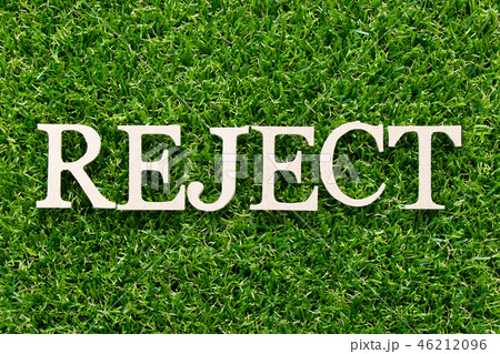 Wood alphabet in word reject on green grass 46212096