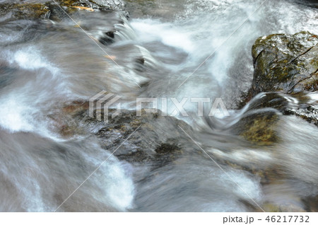 water falling on river pass rock and stone water falling on river pass rock and stone 46217732