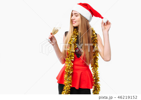 Happy woman in santa hat and dress Happy woman in santa hat and dress 46219152