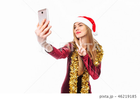 Happy woman in santa hat and dress, shoots herself Happy woman in santa hat and dress, shoots herself 46219185