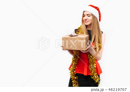 Happy young woman in santa hat and dress 46219707