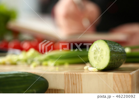 Cook holds knife in hand and cuts on 46220092