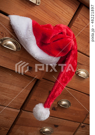 christmas hat on wooden chest of drawers 46221897