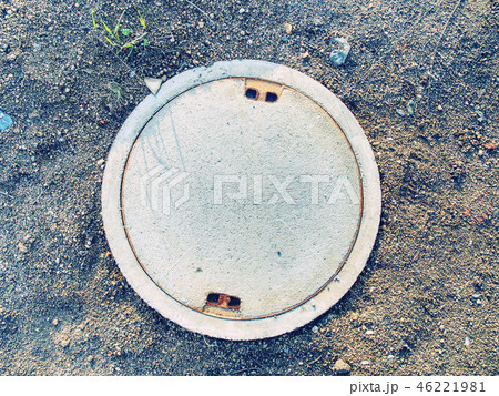 Closed manhole hole with concrete cover. 46221981