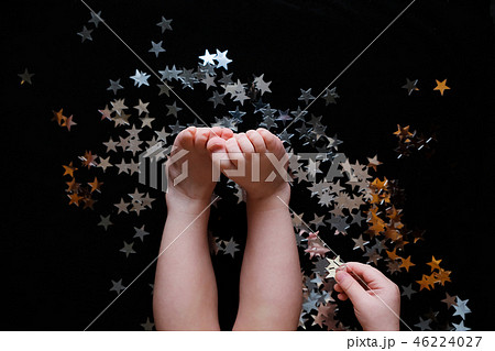 Cute baby play with Silver star sprinkles  46224027