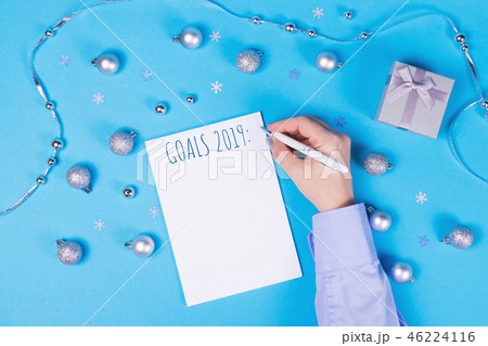Holiday decoration and notebook on blue background. 46224116