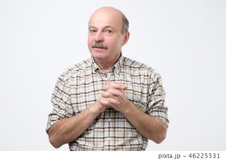Shy senior man feels awkward. Shy senior man feels awkward. 46225531