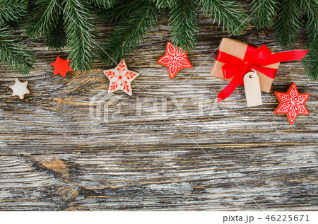 Christmas background with fir tree, gingerbread and gift. 46225671