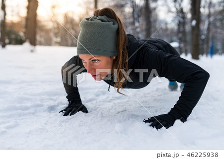Female athlete exercising in park in winter 46225938