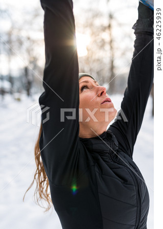 Female athlete exercising in park in winter 46225939