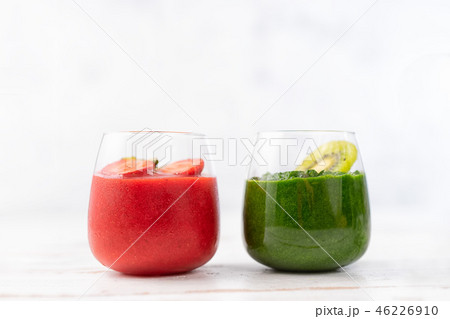 Colorful red and green smoothie in two glasses 46226910