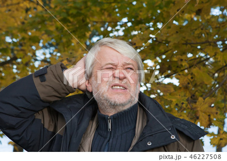 Portrait of middle-aged man in autumn day Portrait of middle-aged man in autumn day 46227508